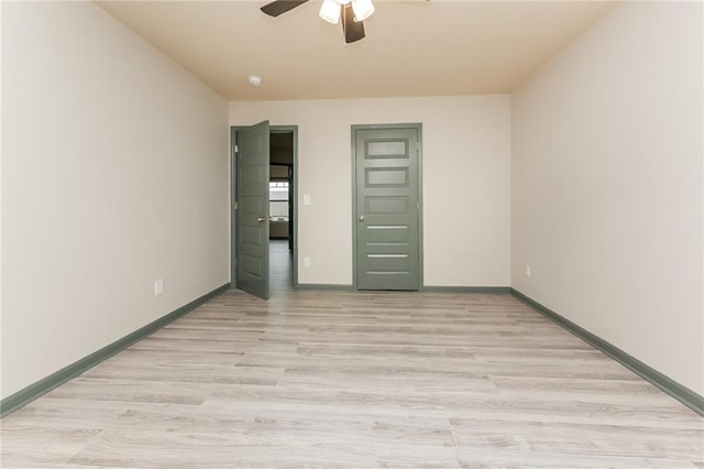 unfurnished bedroom featuring ceiling fan and light wood-type flooring