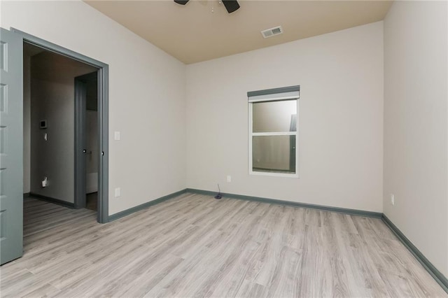 spare room featuring ceiling fan and light hardwood / wood-style floors