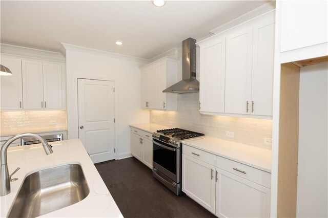 702 Dodd Ln Unit 159, Buford, GA 30518 - kitchen featuring white cabinets, wall chimney exhaust hood, a sink, light countertops, and stainless steel range with gas cooktop