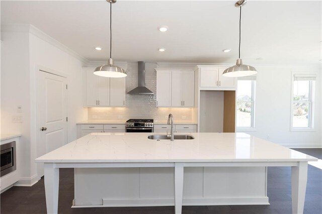 702 Dodd Ln Unit 159, Buford, GA 30518 - kitchen featuring wall chimney range hood, white cabinets, appliances with stainless steel finishes, a sink, and backsplash