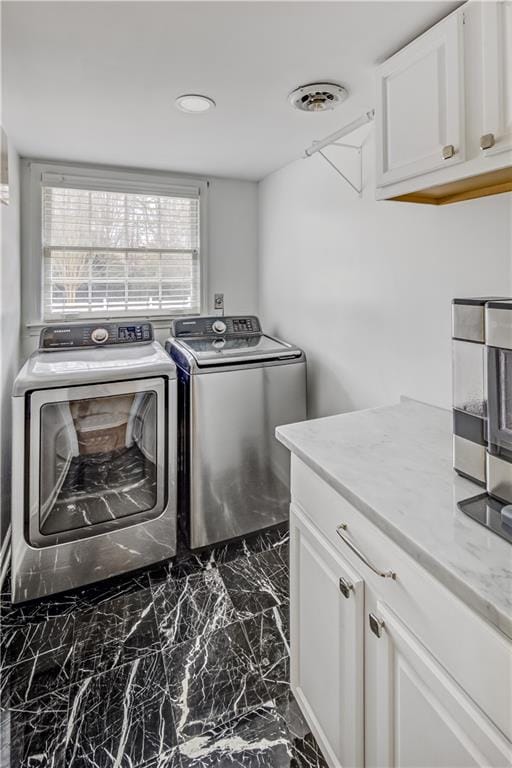 3519 Sunderland Way NE, Brookhaven, GA 30319 - laundry room featuring separate washer and dryer, cabinet space, dark marble finish flooring, and recessed lighting