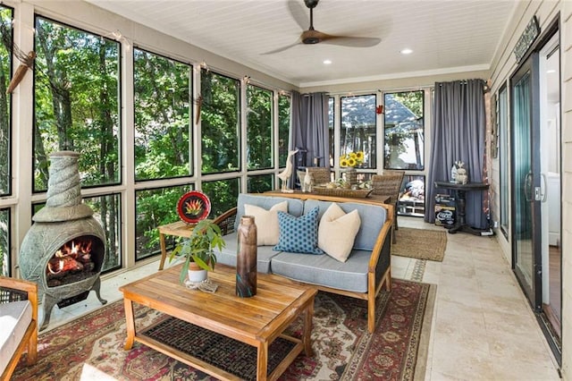 sunroom / solarium with a ceiling fan