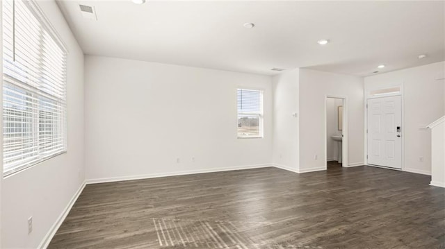 empty room with dark wood-type flooring