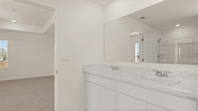 bathroom with walk in shower and vanity