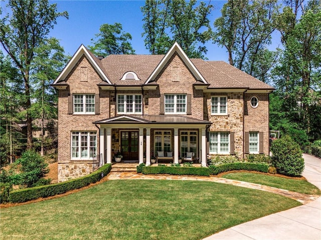 156 Lake Forrest Ln NE, Atlanta, GA 30342 - view of front of property featuring french doors, a front lawn, and brick siding