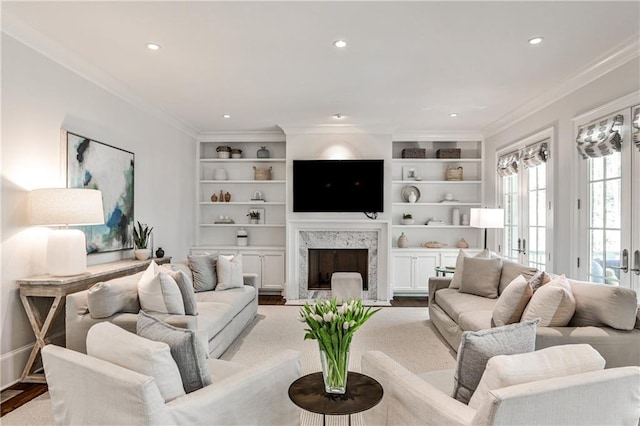 156 Lake Forrest Ln NE, Atlanta, GA 30342 - living area featuring crown molding, recessed lighting, wood finished floors, a fireplace, and built in features