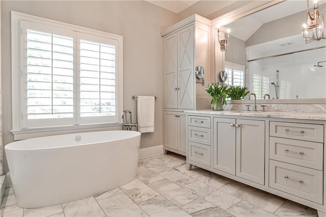 156 Lake Forrest Ln NE, Atlanta, GA 30342 - bathroom with marble look tile flooring, vanity, a shower stall, a freestanding tub, and vaulted ceiling