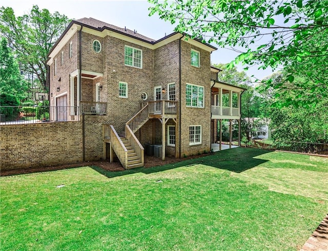 156 Lake Forrest Ln NE, Atlanta, GA 30342 - rear view of property featuring an attached garage, brick siding, and stairs