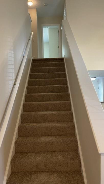 3108 Broadleaf Trl, Fairburn, GA 30213 - staircase with carpet floors