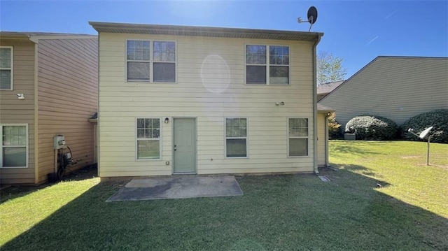 3108 Broadleaf Trl, Fairburn, GA 30213 - rear view of property featuring a lawn and a patio