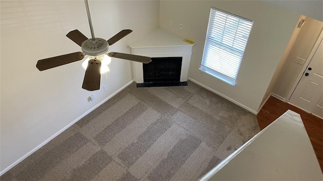 3108 Broadleaf Trl, Fairburn, GA 30213 - detailed view of a ceiling fan, a fireplace with raised hearth, and carpet