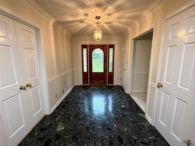 foyer featuring crown molding