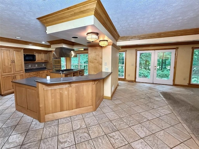 kitchen with black microwave, dark countertops, baseboards, crown molding, and a textured ceiling