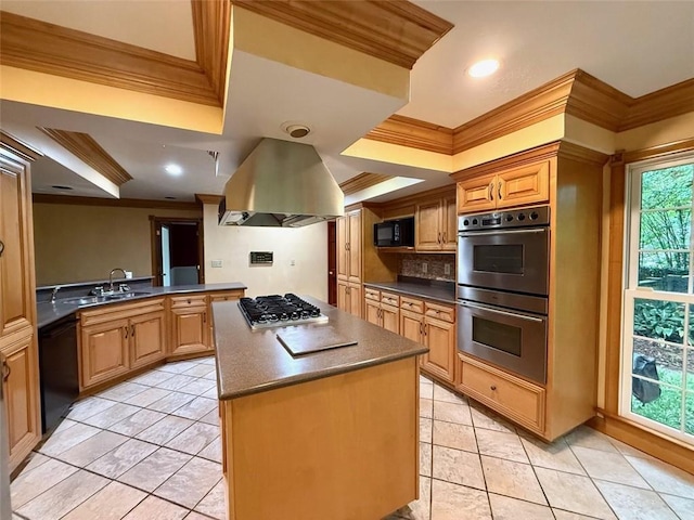 kitchen with black appliances, ornamental molding, dark countertops, a center island, and a sink
