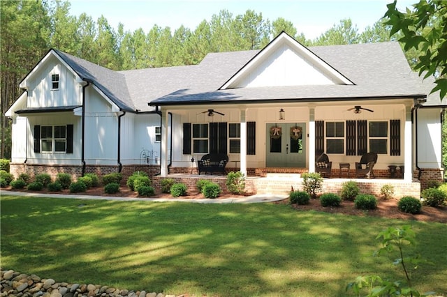 rear view of property with a lawn, ceiling fan, and covered porch