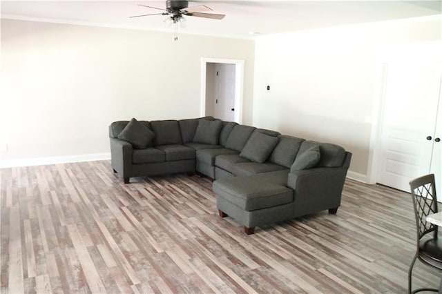 living room with ceiling fan and light hardwood / wood-style floors