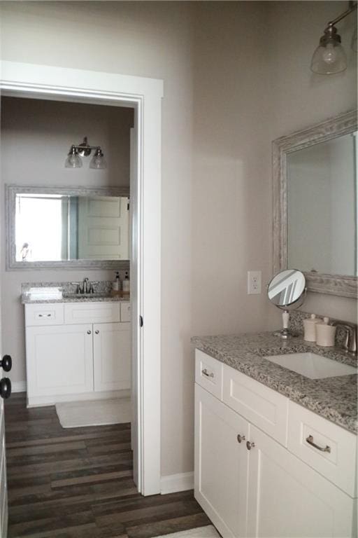 bathroom with hardwood / wood-style floors and vanity