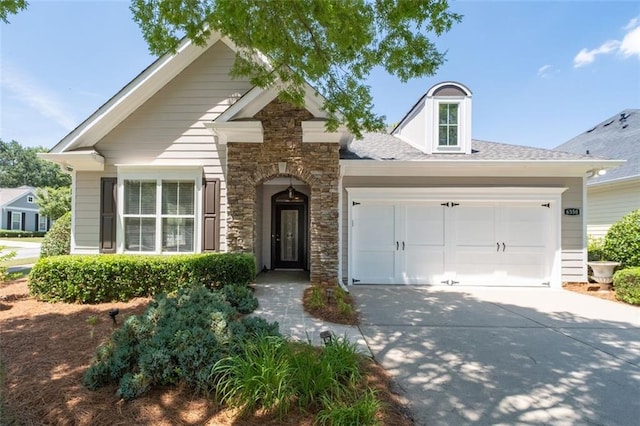 6350 Manningtree Ct, Cumming, GA 30041 - view of front facade featuring stone siding, driveway, and an attached garage