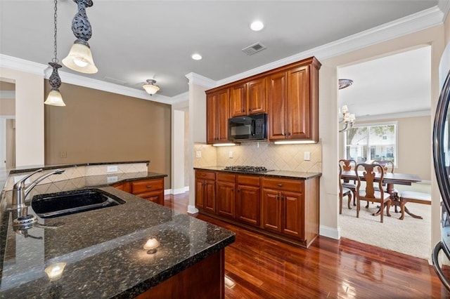 6350 Manningtree Ct, Cumming, GA 30041 - kitchen with a sink, black microwave, tasteful backsplash, dark wood finished floors, and ornamental molding