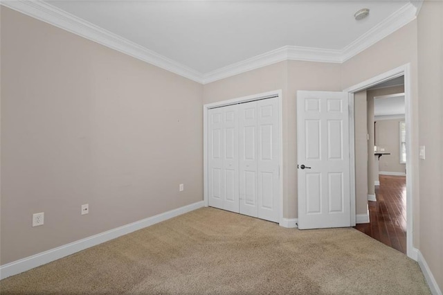 6350 Manningtree Ct, Cumming, GA 30041 - unfurnished bedroom with crown molding, carpet flooring, baseboards, and a closet