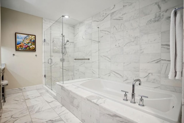 full bathroom featuring a garden tub, baseboards, marble finish floor, and a shower stall