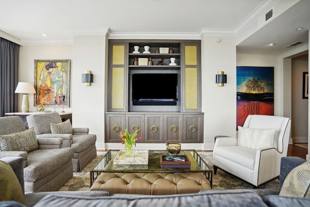 living area with wood finished floors, visible vents, crown molding, and baseboards