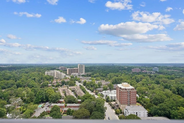 birds eye view of property with a city view and a forest view