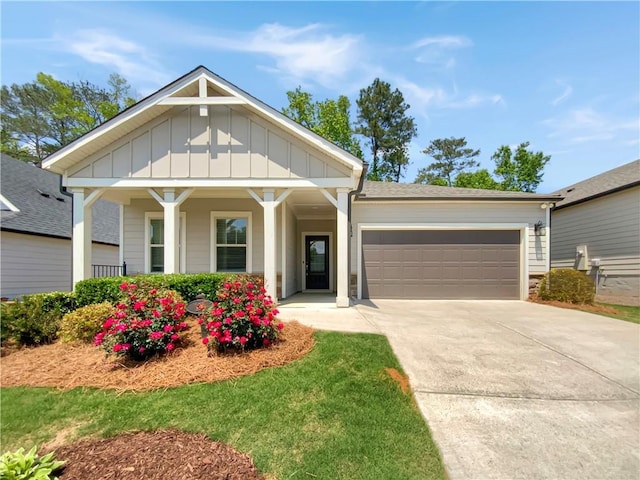 108 Hickory Run, Canton, GA 30115 - craftsman-style house with board and batten siding, driveway, covered porch, and a garage