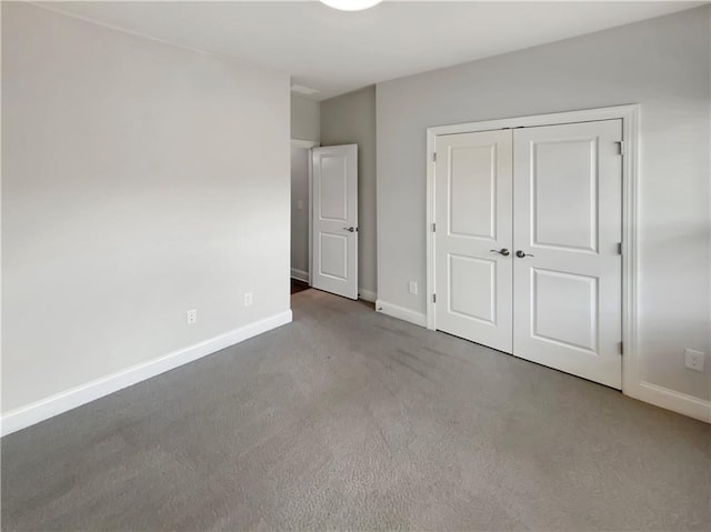 108 Hickory Run, Canton, GA 30115 - unfurnished bedroom with carpet flooring, baseboards, and a closet
