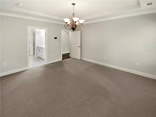 108 Hickory Run, Canton, GA 30115 - unfurnished room featuring an inviting chandelier, a raised ceiling, dark carpet, baseboards, and visible vents