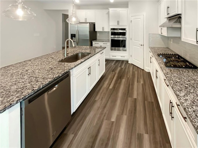 108 Hickory Run, Canton, GA 30115 - kitchen featuring appliances with stainless steel finishes, a sink, white cabinetry, tasteful backsplash, and under cabinet range hood