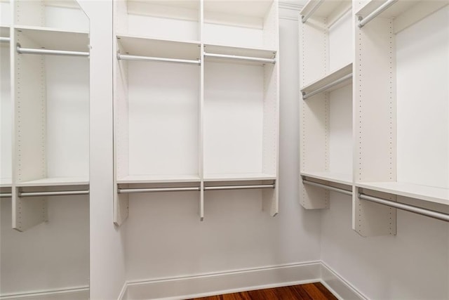 2855 Middlecreek Way Unit 2855, Cumming, GA 30041 - walk in closet featuring dark wood-style floors