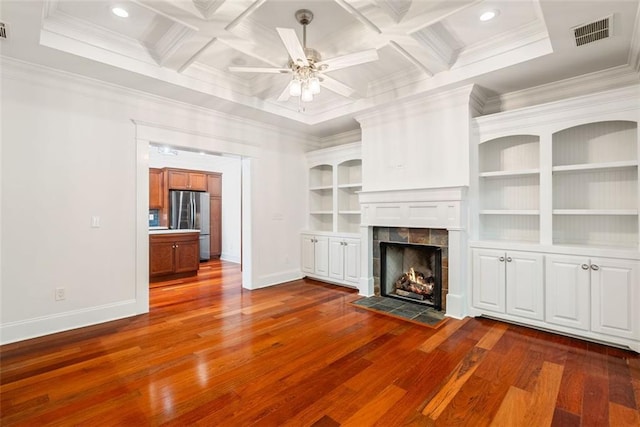2855 Middlecreek Way Unit 2855, Cumming, GA 30041 - unfurnished living room featuring dark wood-style flooring, baseboards, a tile fireplace, ornamental molding, and a ceiling fan