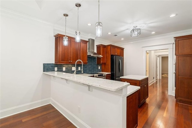 2855 Middlecreek Way Unit 2855, Cumming, GA 30041 - kitchen with freestanding refrigerator, wall chimney exhaust hood, dark wood-type flooring, backsplash, and baseboards