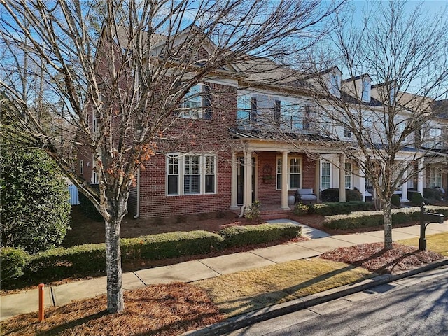 view of front of house featuring brick siding