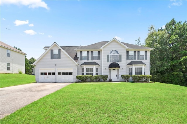 3405 Spring Chase Ln, Ellenwood, GA 30294 - view of front facade featuring a front lawn, concrete driveway, and an attached garage