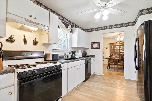 3405 Spring Chase Ln, Ellenwood, GA 30294 - kitchen featuring black appliances, under cabinet range hood, ceiling fan, and dark countertops
