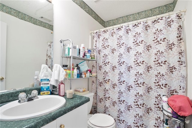 3405 Spring Chase Ln, Ellenwood, GA 30294 - bathroom featuring a textured ceiling, vanity, and curtained shower
