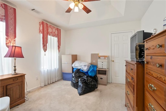 3405 Spring Chase Ln, Ellenwood, GA 30294 - bedroom featuring light colored carpet, a tray ceiling, and ceiling fan