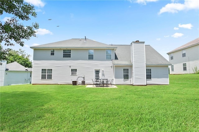 3405 Spring Chase Ln, Ellenwood, GA 30294 - rear view of house with a lawn, a chimney, and a patio area
