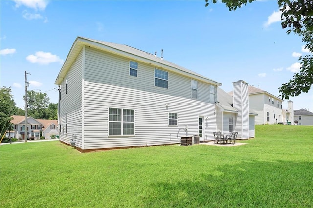 3405 Spring Chase Ln, Ellenwood, GA 30294 - rear view of property with a lawn and a patio area