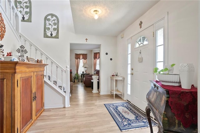 3405 Spring Chase Ln, Ellenwood, GA 30294 - entrance foyer featuring stairway and light wood-style flooring