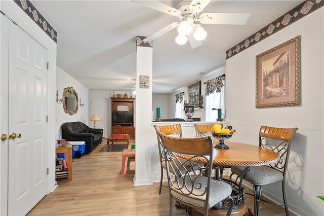 3405 Spring Chase Ln, Ellenwood, GA 30294 - dining space featuring light wood-type flooring and ceiling fan