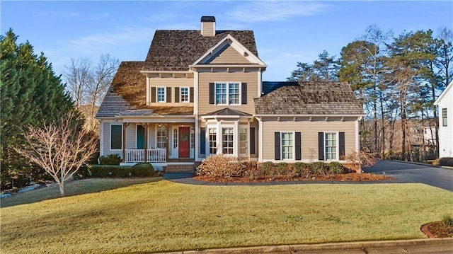 39 Fieldstone Ln, Dawsonville, GA 30534 - traditional-style home featuring a porch, a chimney, and a front lawn