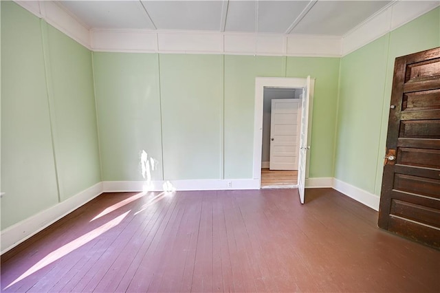 empty room featuring wood-type flooring