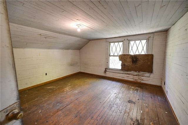 bonus room featuring dark hardwood / wood-style floors, wooden ceiling, and vaulted ceiling