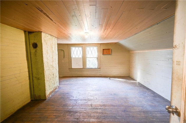 additional living space with dark wood-type flooring, wooden ceiling, and lofted ceiling