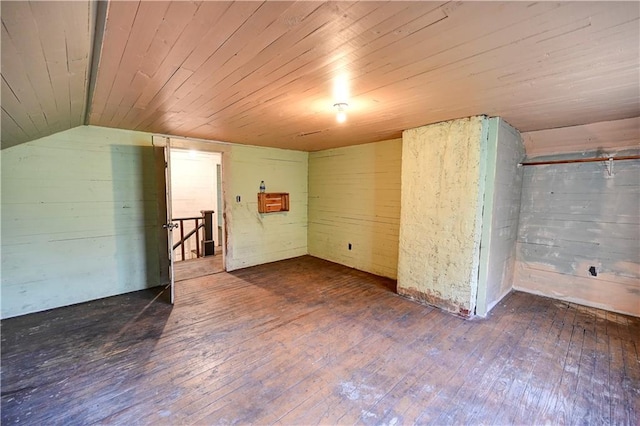 interior space featuring wood ceiling, dark hardwood / wood-style floors, and vaulted ceiling