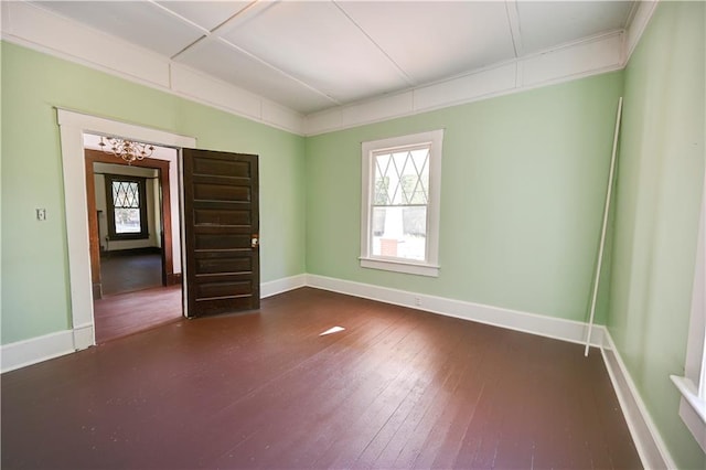 empty room featuring dark hardwood / wood-style flooring