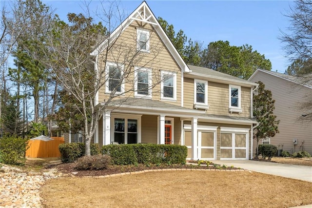 view of front of property with a garage, driveway, fence, and central air condition unit